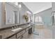 Elegant bathroom featuring a granite vanity, soaking tub and shower at 960 Manchester Ave, Oviedo, FL 32765