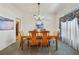 Dining room with a wood table and chairs, and a chandelier at 960 Manchester Ave, Oviedo, FL 32765