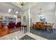 View of the dining room and Gathering room from the entryway at 960 Manchester Ave, Oviedo, FL 32765