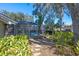 Relaxing pool and patio area with screened enclosure and tropical landscaping at 960 Manchester Ave, Oviedo, FL 32765