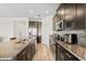 Modern kitchen with stainless steel appliances, granite countertops, and stylish backsplash at 10060 Pecan Hickory Way, Orlando, FL 32832