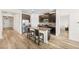 Modern kitchen features granite counters, stainless steel appliances, and a kitchen island at 10060 Pecan Hickory Way, Orlando, FL 32832