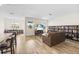 Spacious living room with hardwood floors, a comfortable sofa, and bright natural light at 10060 Pecan Hickory Way, Orlando, FL 32832