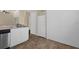 White kitchen with stainless steel appliances and pantry at 102 Vista Verdi Cir # 320, Lake Mary, FL 32746