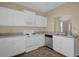 White kitchen with stainless steel appliances at 102 Vista Verdi Cir # 320, Lake Mary, FL 32746