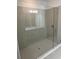 Modern walk-in shower with glass enclosure and neutral tile at 11141 Green Citron Aly, Winter Garden, FL 34787