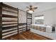 Bedroom with wood-look floors and barn-style sliding doors at 11207 Green Heron Ct, Orlando, FL 32825