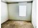 Small bedroom with window and neutral-colored carpet at 12107 Bruceton Way # 102, Orlando, FL 32828