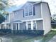 Two-story house with gray siding and large front window at 12107 Bruceton Way # 102, Orlando, FL 32828