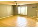 Living room featuring tile floors, bay window, and ceiling fan at 12107 Bruceton Way # 102, Orlando, FL 32828
