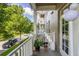Cozy balcony with view of neighborhood street, complete with plants for a touch of nature at 1211 Stonecutter Dr # 206, Celebration, FL 34747