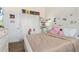 Bright bedroom featuring a white bed, a double door closet and decorated with personal touches at 1211 Stonecutter Dr # 206, Celebration, FL 34747