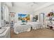 Bright bedroom featuring twin beds, playful decorations, and a ceiling fan at 1211 Stonecutter Dr # 206, Celebration, FL 34747