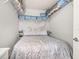Cozy bedroom featuring a queen bed and convenient overhead storage at 1211 Stonecutter Dr # 206, Celebration, FL 34747