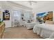 A comfortable bedroom with twin beds, a desk, and a bright window at 1211 Stonecutter Dr # 206, Celebration, FL 34747