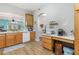 Spacious kitchen offering wooden cabinets, white appliances, and an open design with seamless views to the living room at 1211 Stonecutter Dr # 206, Celebration, FL 34747