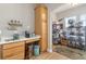 An organized storage area with wooden cabinets, shelves and containers, maximizing space in the unit at 1211 Stonecutter Dr # 206, Celebration, FL 34747