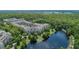 Aerial view of condo community nestled by a tranquil lake at 1211 Stonecutter Dr # 206, Celebration, FL 34747