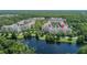 Aerial view showing condo building's location in community by lake at 1211 Stonecutter Dr # 206, Celebration, FL 34747