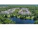 Aerial view highlighting condo community near a peaceful lake at 1211 Stonecutter Dr # 206, Celebration, FL 34747