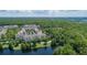 Aerial view showcasing condo community near a serene lake at 1211 Stonecutter Dr # 206, Celebration, FL 34747