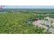 Aerial view of community near lake, showing location of condo building at 1211 Stonecutter Dr # 206, Celebration, FL 34747