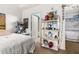 Bright bedroom with a bed and built-in shelving at 1211 Stonecutter Dr # 206, Celebration, FL 34747