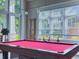 Game room featuring a pool table and large windows at 1211 Stonecutter Dr # 206, Celebration, FL 34747