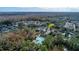 Aerial view of community pool and clubhouse with autumn foliage at 1211 Stonecutter Dr # 206, Celebration, FL 34747
