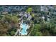 Aerial view of community pool, clubhouse, and surrounding landscape at 1211 Stonecutter Dr # 206, Celebration, FL 34747