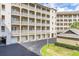 Condo building with parking and landscaping at 1211 Stonecutter Dr # 206, Celebration, FL 34747