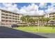 Residential building with balconies and lush landscaping at 1211 Stonecutter Dr # 206, Celebration, FL 34747