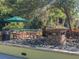 Community courtyard with fountain, seating, and umbrella at 1211 Stonecutter Dr # 206, Celebration, FL 34747