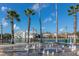 Community plaza featuring a water fountain, palm trees, and benches at 1211 Stonecutter Dr # 206, Celebration, FL 34747