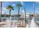 Community plaza with a central fountain, palm trees and benches near the lake at 1211 Stonecutter Dr # 206, Celebration, FL 34747