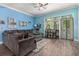 Spacious living room with sectional sofa and hardwood floors at 1211 Stonecutter Dr # 206, Celebration, FL 34747