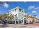 Bustling streetscape showcasing shops, restaurants, and palm trees at 1211 Stonecutter Dr # 206, Celebration, FL 34747