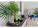 Elegant dining area with marble table and blue velvet chairs at 1236 Big Bass Dr, Ormond Beach, FL 32174