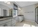 Bathroom with double vanity and large mirror at 12754 Brodlove Ln, Winter Garden, FL 34787