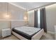 Serene bedroom with a plush bed, elegant wallpaper, and window coverings at 12754 Brodlove Ln, Winter Garden, FL 34787