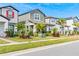 Street view of charming homes with palm trees and lush landscaping at 12754 Brodlove Ln, Winter Garden, FL 34787