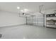 Clean and spacious garage with overhead door and storage shelving at 12754 Brodlove Ln, Winter Garden, FL 34787
