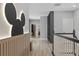 Upstairs hallway with built-in shelving and staircase at 12754 Brodlove Ln, Winter Garden, FL 34787