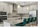 Modern kitchen with white cabinets, gray countertops, and stainless steel appliances at 12754 Brodlove Ln, Winter Garden, FL 34787
