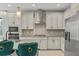 Modern kitchen with white cabinets, gray countertops, and stainless steel appliances at 12754 Brodlove Ln, Winter Garden, FL 34787