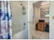 Bathroom featuring a shower/tub combination, white door, and ceramic tile at 14101 Vista Del Lago Blvd, Clermont, FL 34711