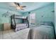 Whimsical ' bedroom with bunkbeds, a twin bed, ceiling fan, and marine-themed wall art at 14101 Vista Del Lago Blvd, Clermont, FL 34711