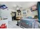 Bright bedroom with ample closet space, natural light, and decorated with fun artwork at 14101 Vista Del Lago Blvd, Clermont, FL 34711