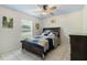 Cozy bedroom featuring tile flooring, a ceiling fan, and a window with blinds at 14101 Vista Del Lago Blvd, Clermont, FL 34711