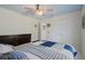 This bedroom has a large closet, neutral walls, and a lovely ceiling fan at 14101 Vista Del Lago Blvd, Clermont, FL 34711